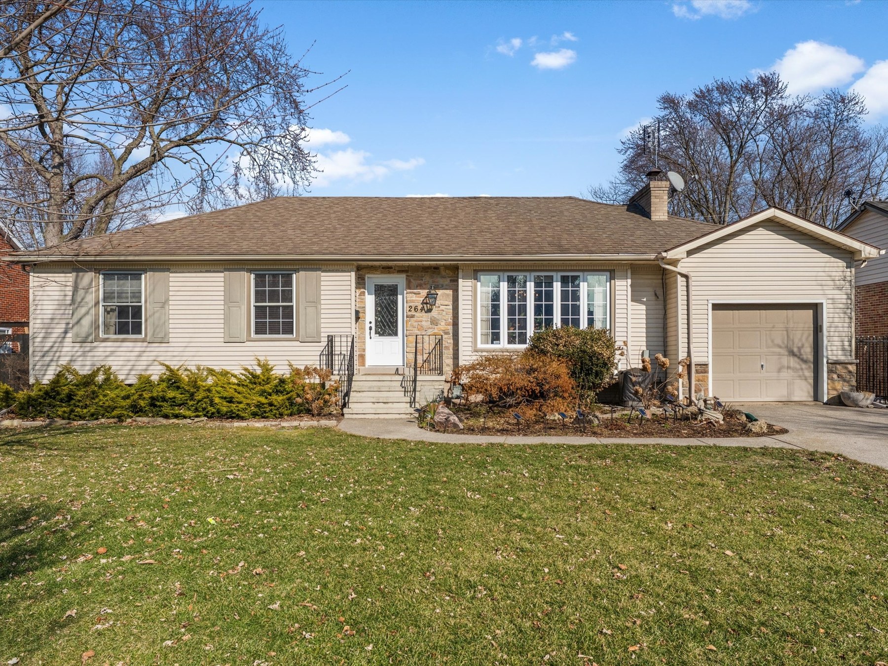 Front exterior with attached garage